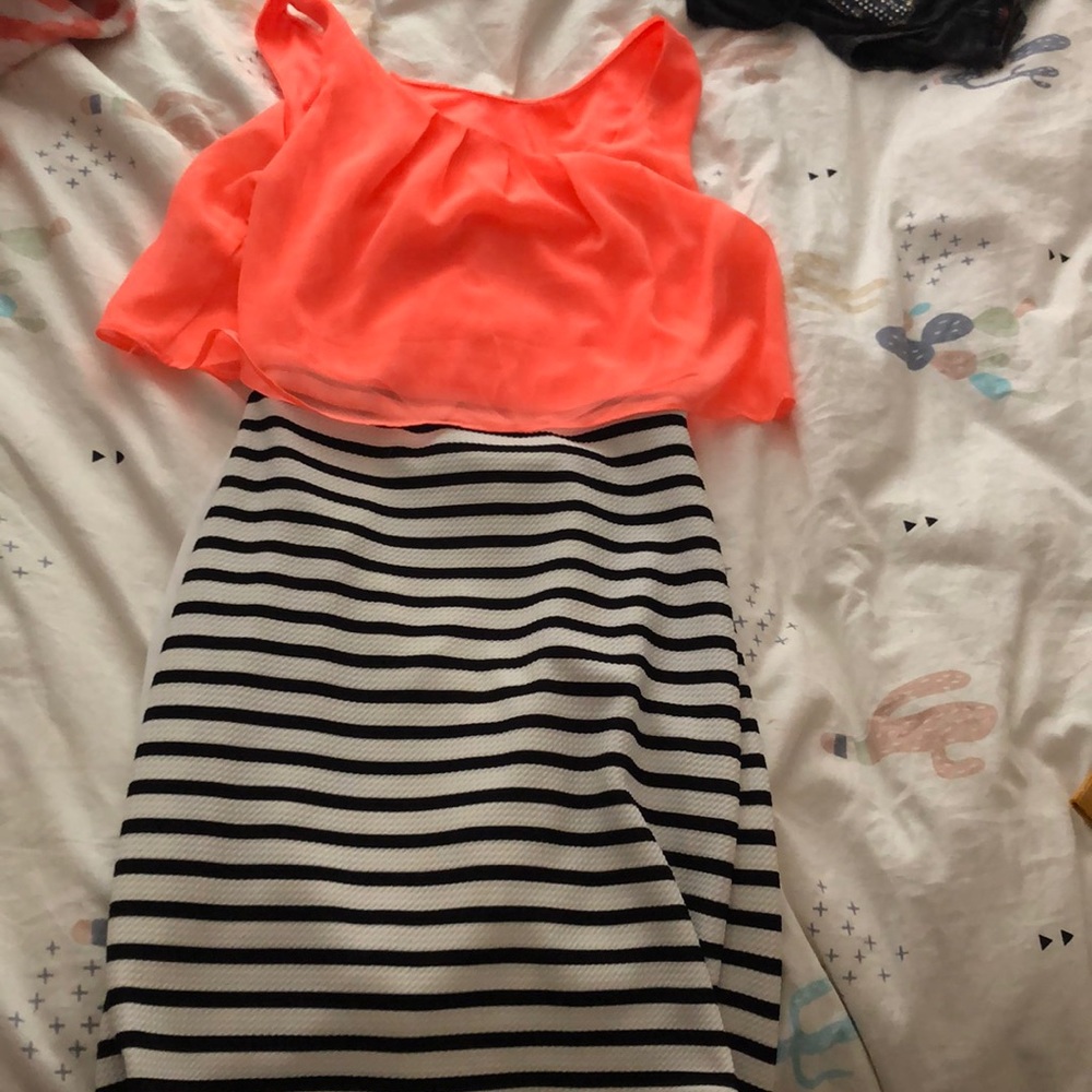 A bright orange top & strip black &white bottom